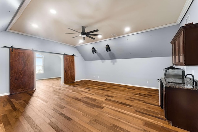 5000 Moretto Ct, Spring Hill, TN 37174 - bonus room with a barn door, a ceiling fan, vaulted ceiling, and hardwood / wood-style floors