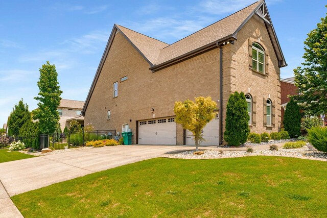 5000 Moretto Ct, Spring Hill, TN 37174 - view of property exterior with a garage, concrete driveway, and brick siding