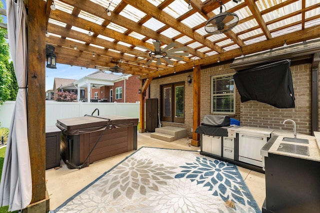 5000 Moretto Ct, Spring Hill, TN 37174 - view of patio with a hot tub, ceiling fan, an outdoor kitchen, and a pergola
