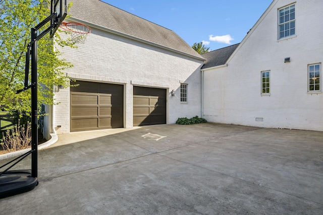 6124 Montcrest Dr, Nashville, TN 37215 - view of side of home with brick siding, driveway, and roof with shingles