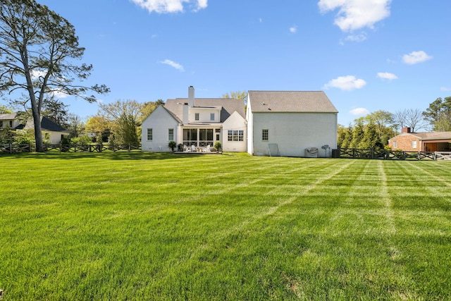 6124 Montcrest Dr, Nashville, TN 37215 - rear view of property with a sunroom, a lawn, a chimney, and a fenced backyard