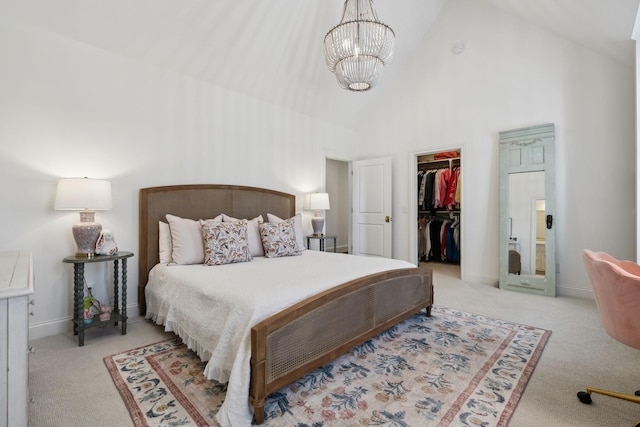 6124 Montcrest Dr, Nashville, TN 37215 - carpeted bedroom with a walk in closet, a closet, baseboards, a chandelier, and high vaulted ceiling
