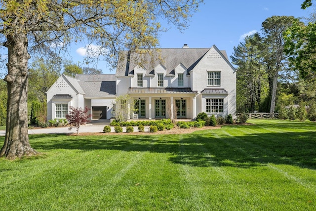 6124 Montcrest Dr, Nashville, TN 37215 - view of front facade featuring a front yard, a chimney, a standing seam roof, and metal roof