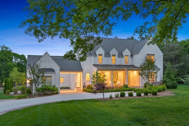 6124 Montcrest Dr, Nashville, TN 37215 - modern farmhouse style home with concrete driveway, a standing seam roof, a yard, and metal roof