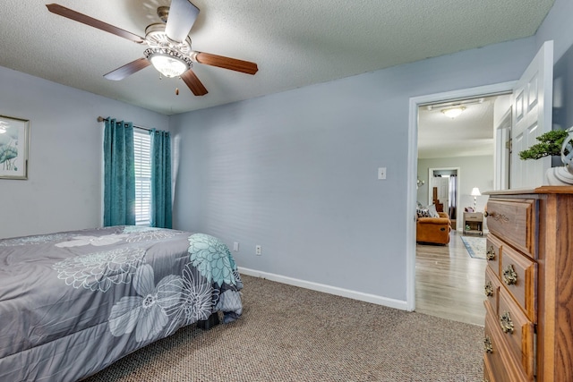 1496 Wade Brown Rd, Lewisburg, TN 37091 - carpeted bedroom with baseboards, a textured ceiling, and ceiling fan