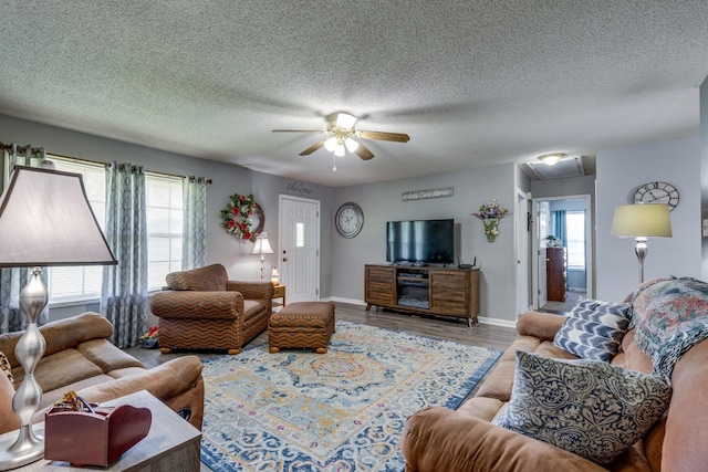 1496 Wade Brown Rd, Lewisburg, TN 37091 - living room featuring ceiling fan, plenty of natural light, a textured ceiling, and wood finished floors