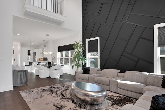 1024 Club View Dr Unit A101, Gallatin, TN 37066 - living room featuring a chandelier, dark wood finished floors, a towering ceiling, and baseboards