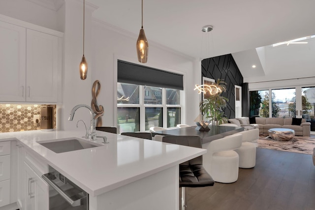 1024 Club View Dr Unit A101, Gallatin, TN 37066 - kitchen featuring white cabinets, stainless steel dishwasher, a sink, decorative backsplash, and open floor plan