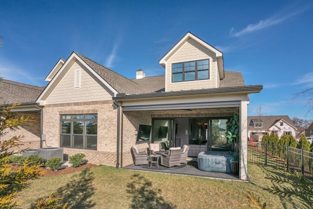 1024 Club View Dr Unit A101, Gallatin, TN 37066 - back of property with fence, brick siding, outdoor lounge area, a yard, and a patio
