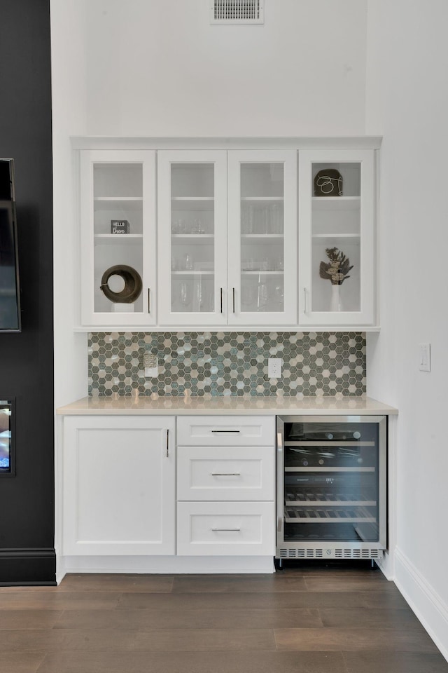 1024 Club View Dr Unit A101, Gallatin, TN 37066 - bar with tasteful backsplash, baseboards, dark wood-style flooring, and wine cooler