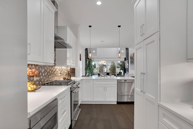 1024 Club View Dr Unit A101, Gallatin, TN 37066 - kitchen featuring stainless steel appliances, dark wood-style flooring, white cabinetry, decorative backsplash, and wall chimney range hood