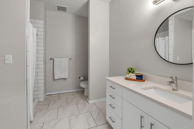 1900 12th Ave S Unit 219, Nashville, TN 37203 - full bath featuring toilet, visible vents, marble finish floor, curtained shower, and vanity