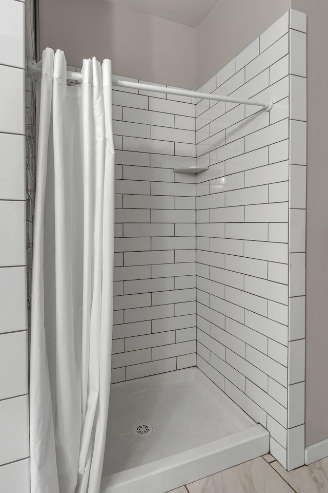 1900 12th Ave S Unit 219, Nashville, TN 37203 - full bath with marble finish floor and a stall shower