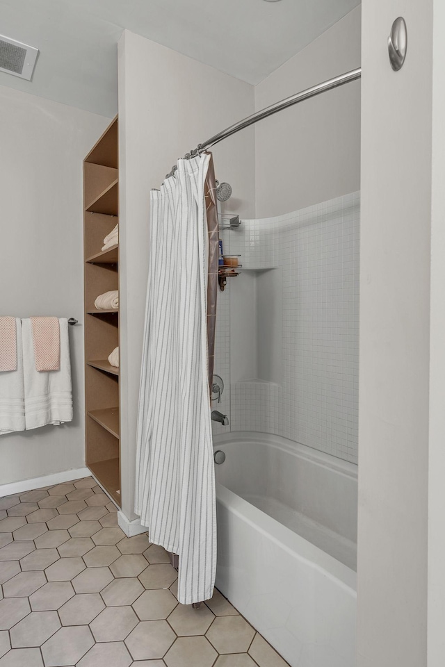 1900 12th Ave S Unit 219, Nashville, TN 37203 - bathroom featuring shower / tub combo with curtain and visible vents