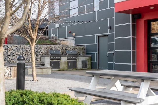 1900 12th Ave S Unit 219, Nashville, TN 37203 - view of patio / terrace with exterior kitchen and area for grilling