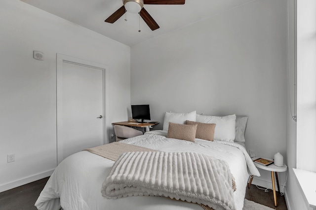 1900 12th Ave S Unit 219, Nashville, TN 37203 - bedroom featuring baseboards and ceiling fan