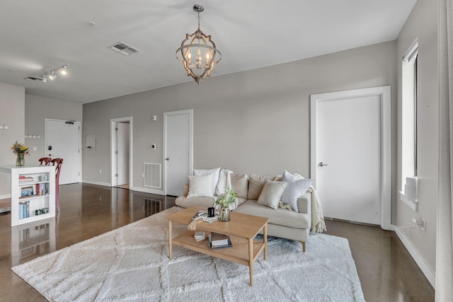 1900 12th Ave S Unit 219, Nashville, TN 37203 - living area featuring baseboards, visible vents, and an inviting chandelier