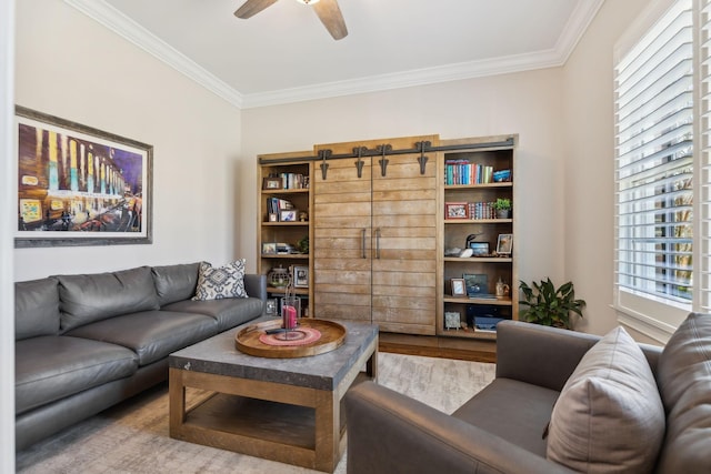 living room with ceiling fan, ornamental molding, and wood finished floors