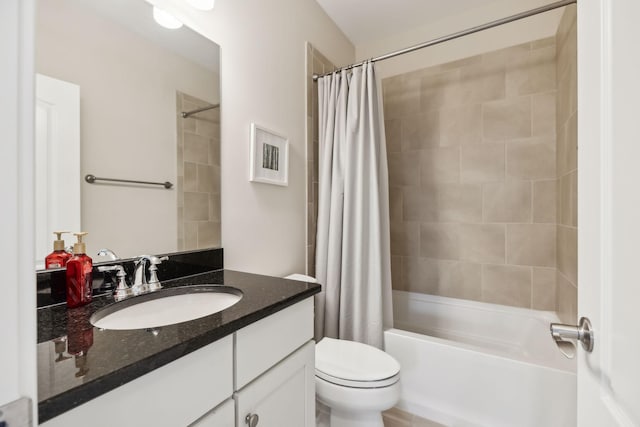 bathroom with vanity, shower / bathtub combination with curtain, and toilet