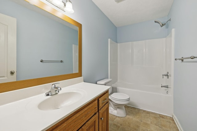 bathroom featuring toilet, vanity, and shower / tub combination