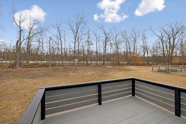 wooden terrace with a yard