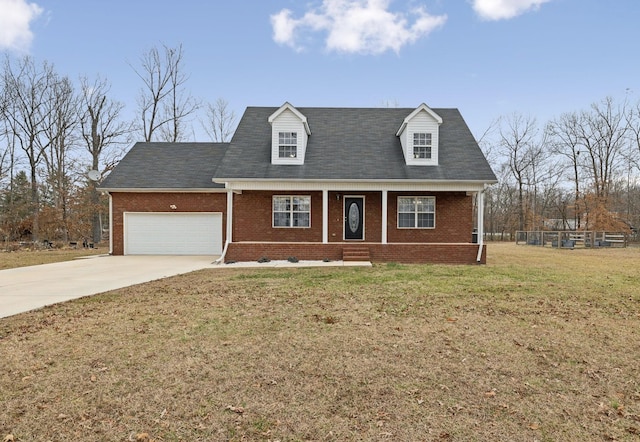 cape cod house with an attached garage, driveway, brick siding, and a front yard