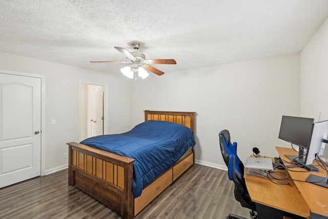 bedroom with wood finished floors, a textured ceiling, a ceiling fan, and baseboards