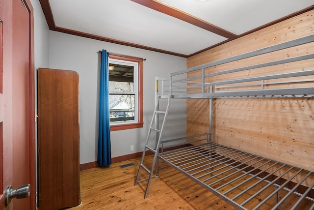 237 Cooper Ln, Smithville, TN 37166 - unfurnished bedroom featuring hardwood / wood-style floors, visible vents, baseboards, and ornamental molding