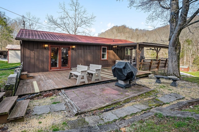 237 Cooper Ln, Smithville, TN 37166 - rear view of house with a deck, board and batten siding, french doors, and metal roof
