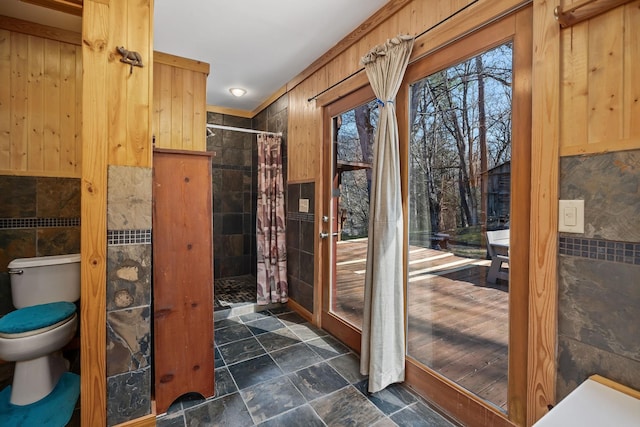237 Cooper Ln, Smithville, TN 37166 - full bath featuring tile walls, stone finish flooring, toilet, and a stall shower