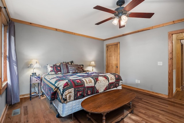 237 Cooper Ln, Smithville, TN 37166 - bedroom with wood finished floors, visible vents, a ceiling fan, and baseboards