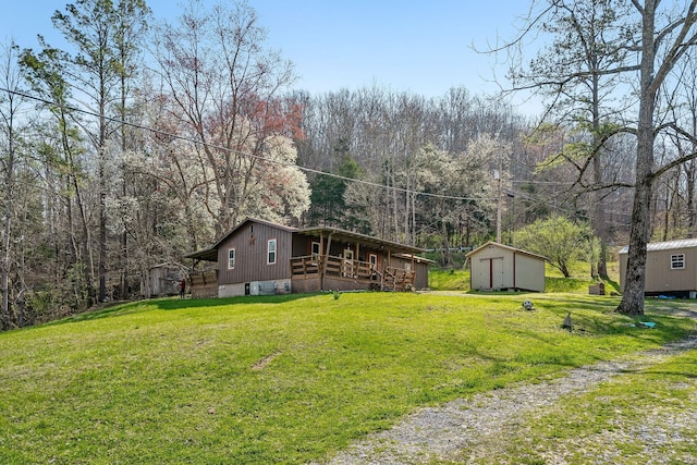 237 Cooper Ln, Smithville, TN 37166 - exterior space with a wooden deck, an outdoor structure, and a storage shed