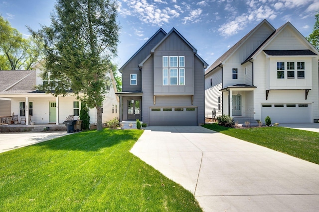 modern farmhouse style home featuring a garage, board and batten siding, a front lawn, and concrete driveway