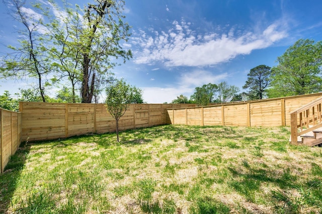 view of yard featuring a fenced backyard
