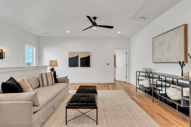 living room featuring attic access, baseboards, recessed lighting, light wood-style floors, and ceiling fan