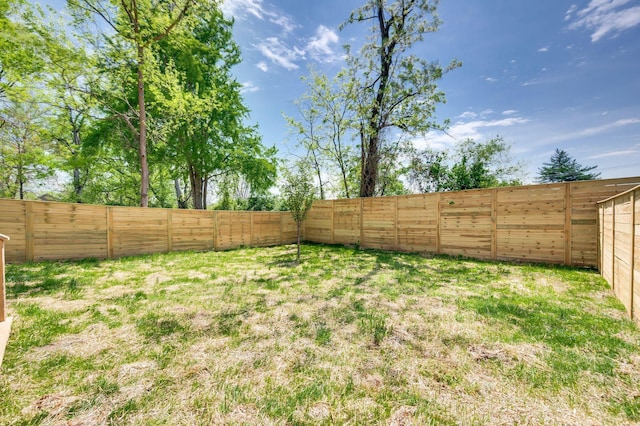 view of yard with a fenced backyard