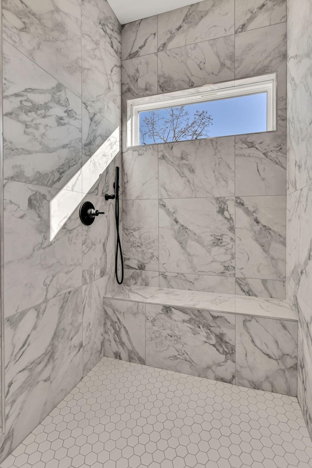 bathroom featuring tiled shower