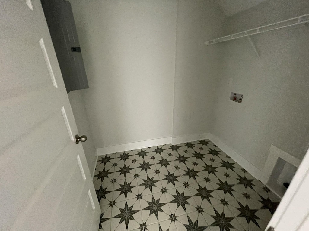 washroom featuring tile patterned floors, hookup for a washing machine, and laundry area