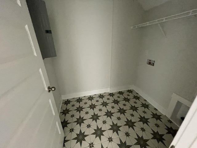 washroom featuring tile patterned floors, hookup for a washing machine, and laundry area
