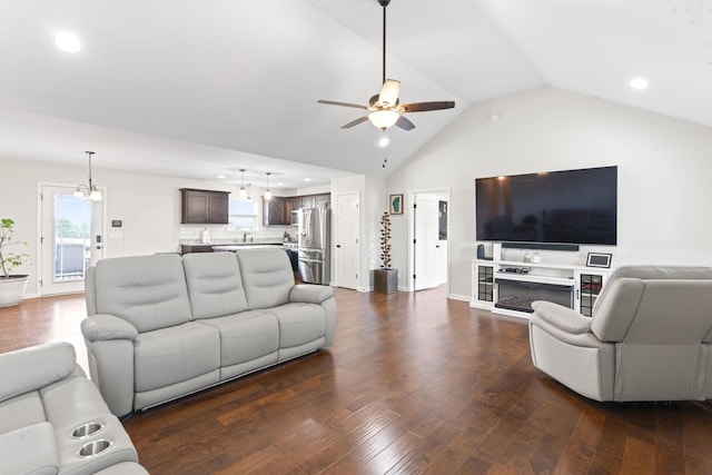 1132 Richland Farms Dr, Manchester, TN 37355 - living room with vaulted ceiling, recessed lighting, ceiling fan with notable chandelier, and dark wood-style floors