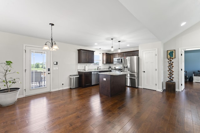 1132 Richland Farms Dr, Manchester, TN 37355 - kitchen with dark brown cabinetry, an inviting chandelier, stainless steel appliances, decorative backsplash, and a kitchen island