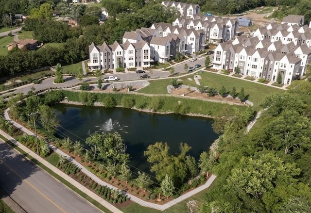 bird's eye view with a residential view and a water view