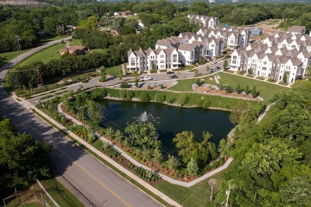 birds eye view of property with a residential view and a water view