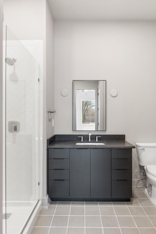 full bath with tile patterned flooring, a shower stall, toilet, and vanity