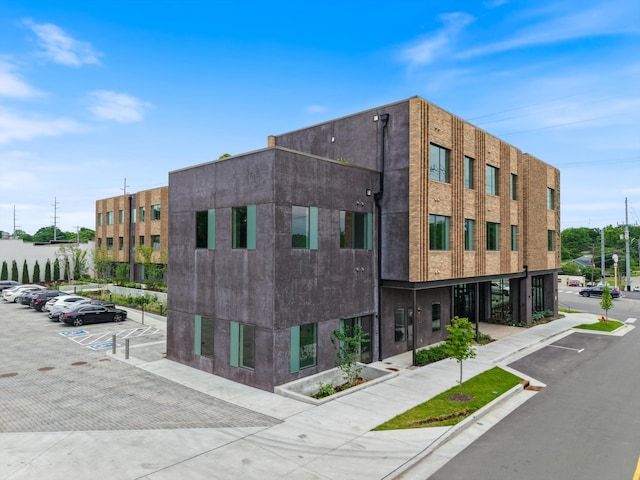 view of property with uncovered parking