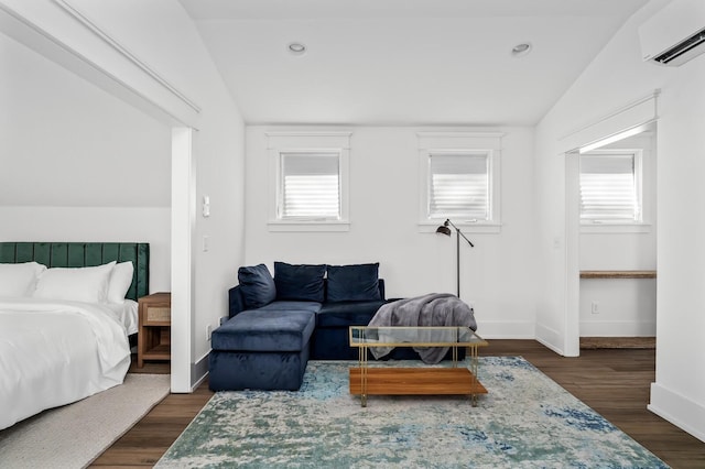 2510 Belmont Blvd, Nashville, TN 37212 - bedroom with baseboards, dark wood finished floors, lofted ceiling, and a wall unit AC
