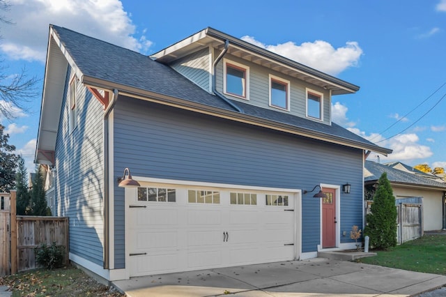 2510 Belmont Blvd, Nashville, TN 37212 - view of front of home featuring a garage, driveway, a shingled roof, and fence