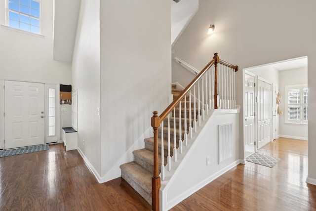 2142 Gold Valley Dr, Murfreesboro, TN 37130 - foyer entrance with stairs, a towering ceiling, wood finished floors, and a healthy amount of sunlight