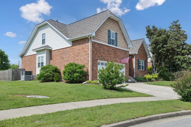 2142 Gold Valley Dr, Murfreesboro, TN 37130 - view of front of home with a front yard, a garage, brick siding, fence, and concrete driveway