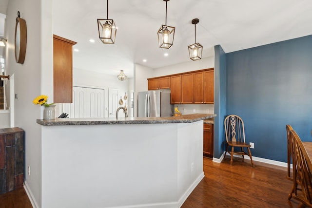 2142 Gold Valley Dr, Murfreesboro, TN 37130 - kitchen featuring brown cabinets, dark wood finished floors, freestanding refrigerator, recessed lighting, and baseboards
